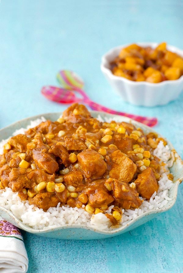 A plate full of food, with Curry and Chicken