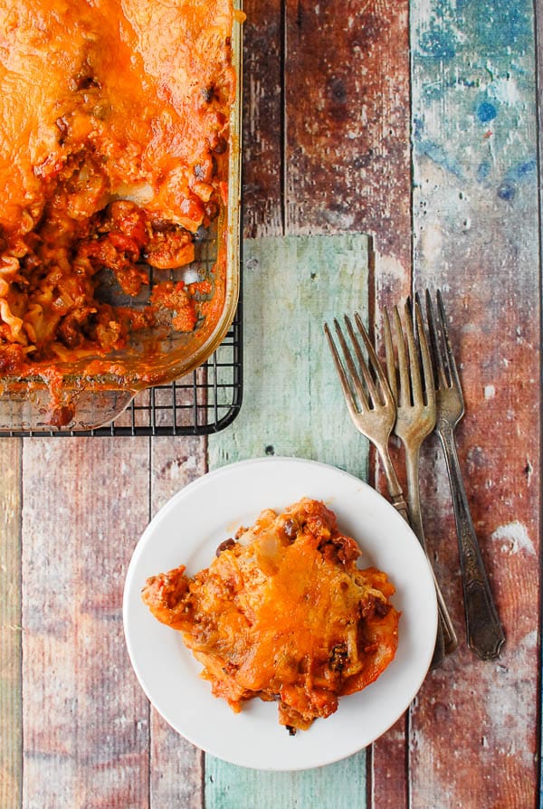 Mexican Lasagna serving on plate with lasagna pan 