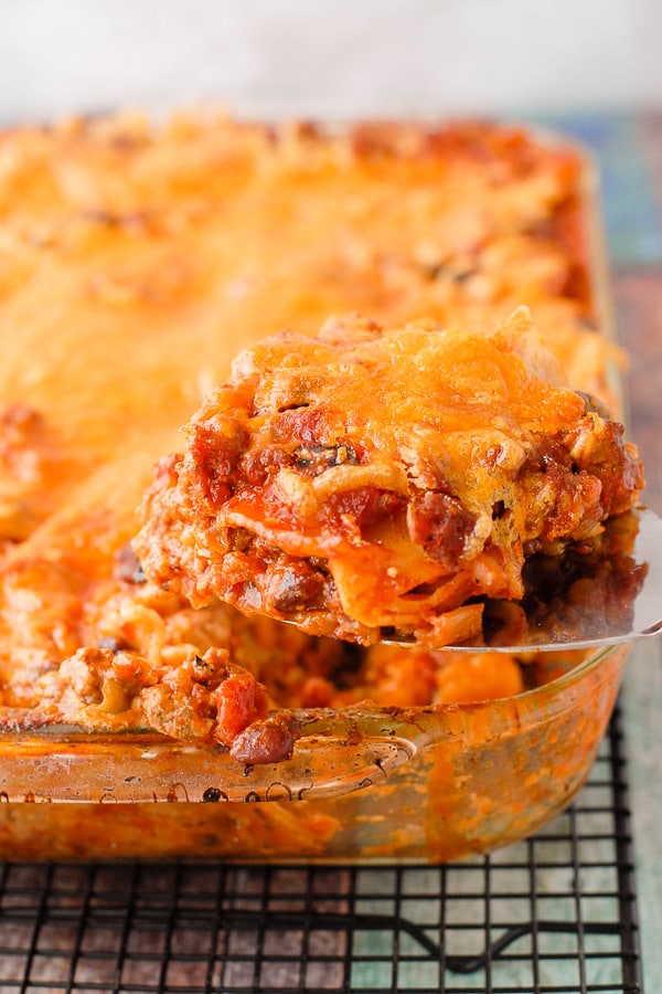 Mexican Lasagna serving on spatula