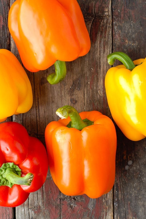 Orange, red and yellow sweet bell peppers 