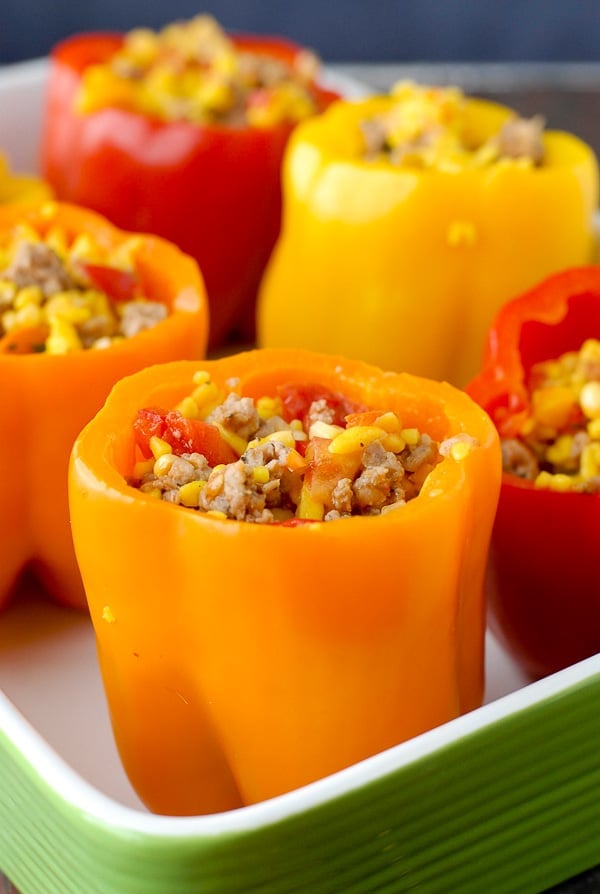 Colorful orange, red and yellow Sausage and Orzo Stuffed Sweet Peppers