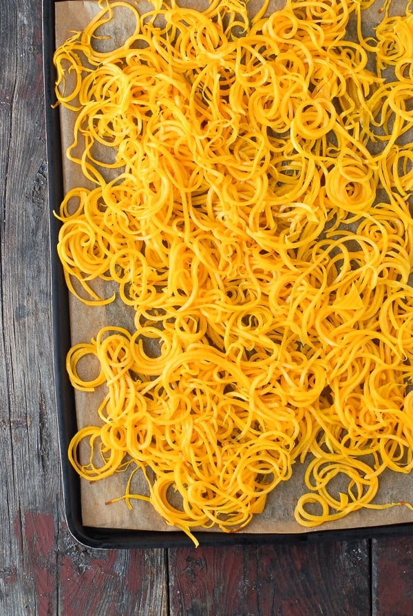 Spiralized Butternut Squash Noodles on black baking sheet