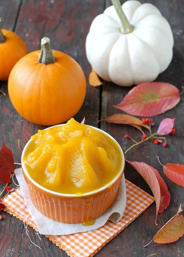 DIY Homemade Pumpkin Puree in orange bowl with small pumpkins