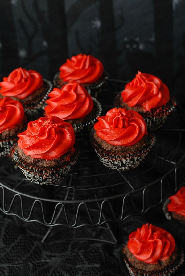 A close up of Gluten-Free Red Devil Cupcakes {Devil\'s Food cupcakes with Red Hots Cinnamon Buttercream Frosting}