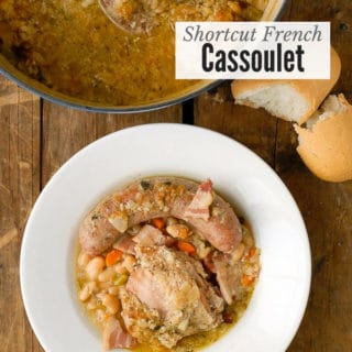 Shortcut French Cassoulet bean chicken and sausage stew in a white bowl