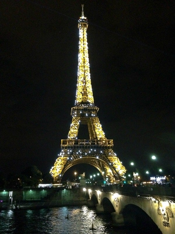 Eiffel Tower at night across the Seine River