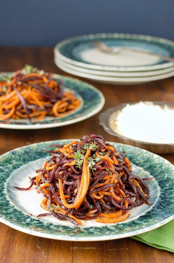 Spiralized Roasted Garlic-Cinnamon Sweet Potato Noodles on a green plate