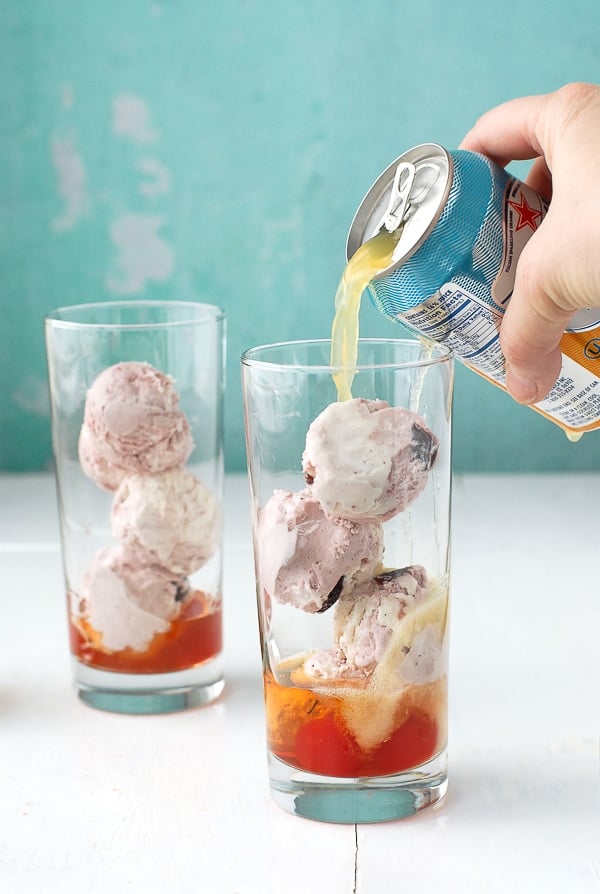 Collins glasses with bourbon, maraschino cherries and cherry-vanilla ice cream balls