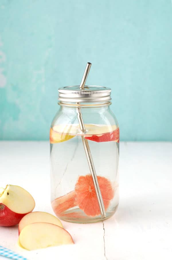 Mason jars of homemade Infused Spa Water with fruits, vegetables and herbs