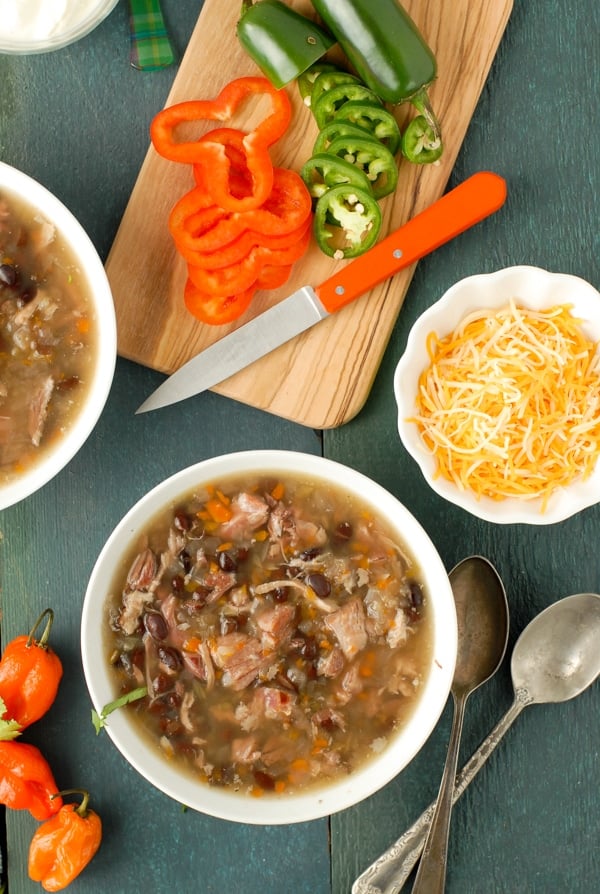 Bowl of chunky slow cooker black bean and hambone soup with cumin