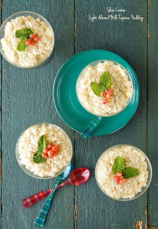 Four servings of Slow Cooker Light Almond Milk Tapioca Pudding with mint leaves