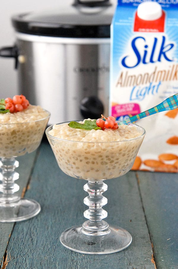 Slow Cooker Light Almond Milk Tapioca Pudding in glass goblets with slow cooker in background