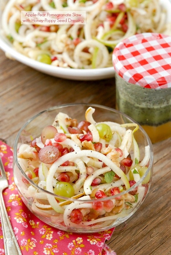 Spiralized Apple and Pears Pomegranate Slaw with jar of Honey-Poppy Seed Dressing 