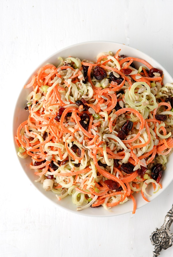large bowl of Spiralizer Broccoli Stem Carrot Slaw with Dried Cranberries and Sunflower Seeds from above