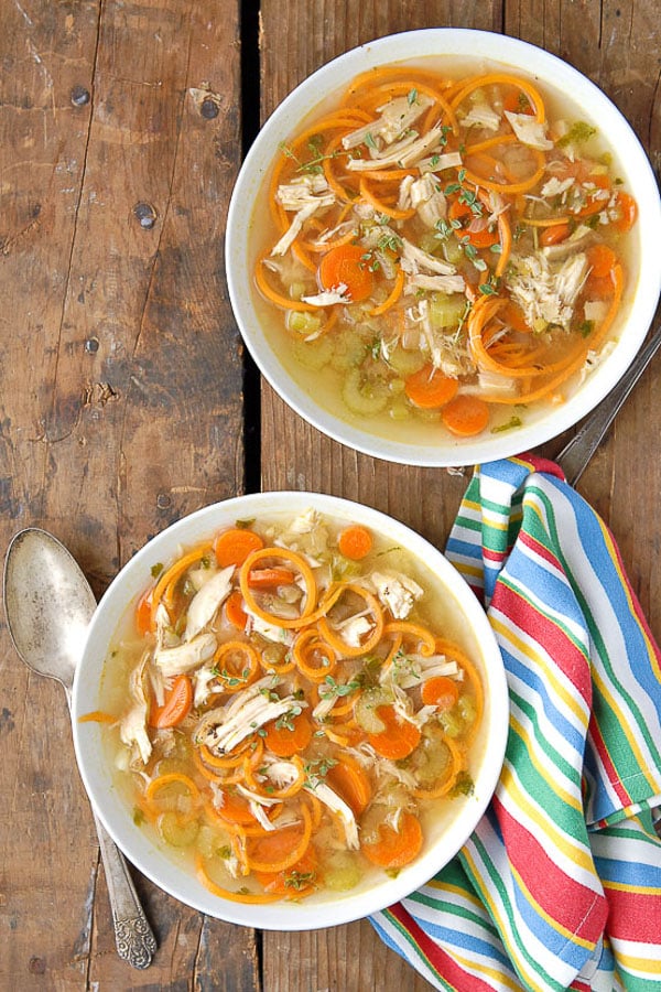 bowls of chicken soup with sweet potato noodles