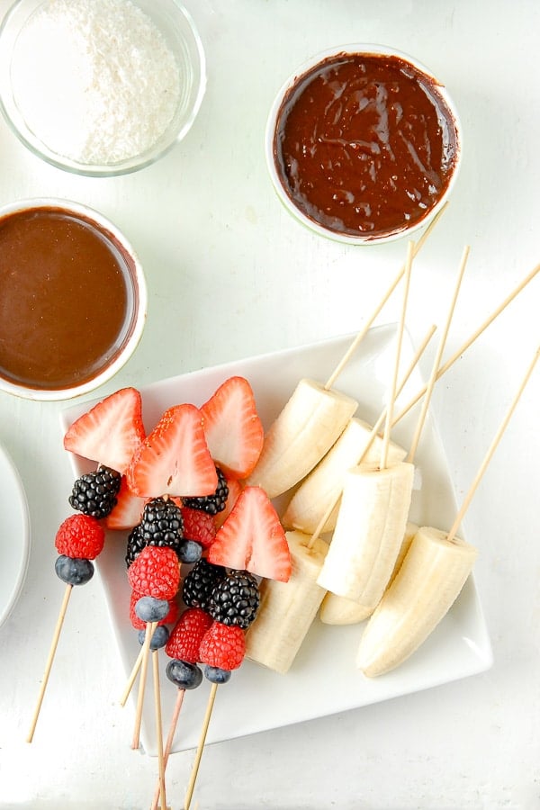 Chocolate Fondue pots with coconut and fruit skewers 