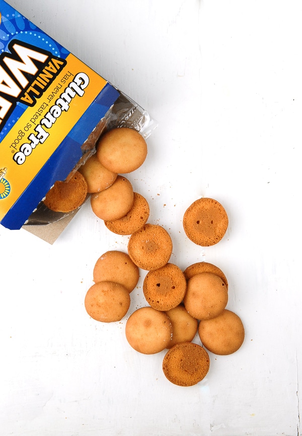 An open package of Gluten-Free Vanilla Wafers spilling out on a white background.