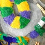 Mardi Gras King Cake with sprinkles and mask