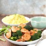 Spicy Garlic Sriracha Shrimp and Broccoli Stir Fry in a white bowl