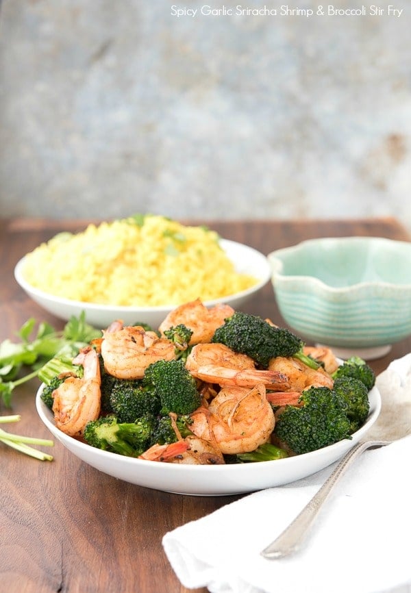 Spicy Garlic Sriracha Shrimp and Broccoli Stir Fry in a white bowl