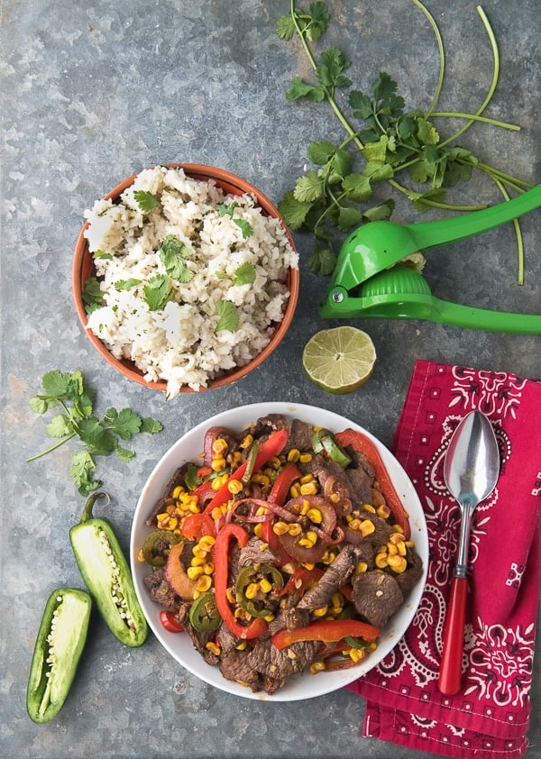 Spicy Southwestern Steak Stir Fry,Cilantro-Lime Rice, sliced jalapeno pepper, fresh cilantro and red bandana napkin