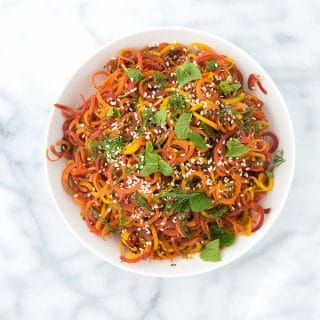 white bowl of Spiralized Roasted Carrots with Mint and Dill