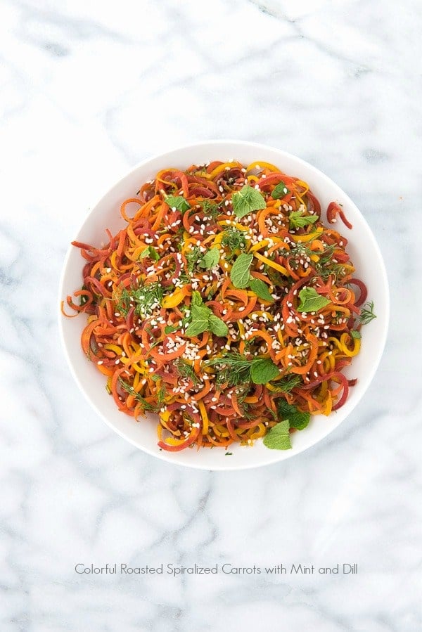 white bowl of Spiralized Roasted Carrots with Mint and Dill