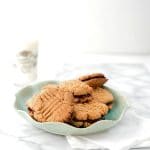 Peanut Butter and Jelly Sandwich Cookies with a glass of milk -