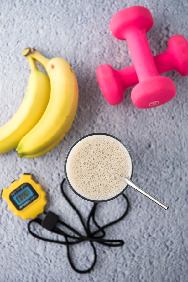 Bananas, hand weights, stopwatch and smoothie