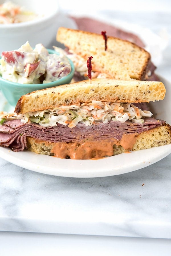 Brooklyn Avenue Sandwich {Pastrami, Cole Slaw, Russian Dressing, Rye} on white plate