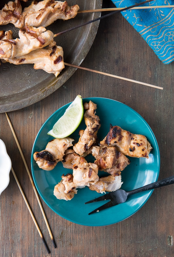 Grilled Chicken Thigh Satay with Peanut Dipping Sauce with lime wedge