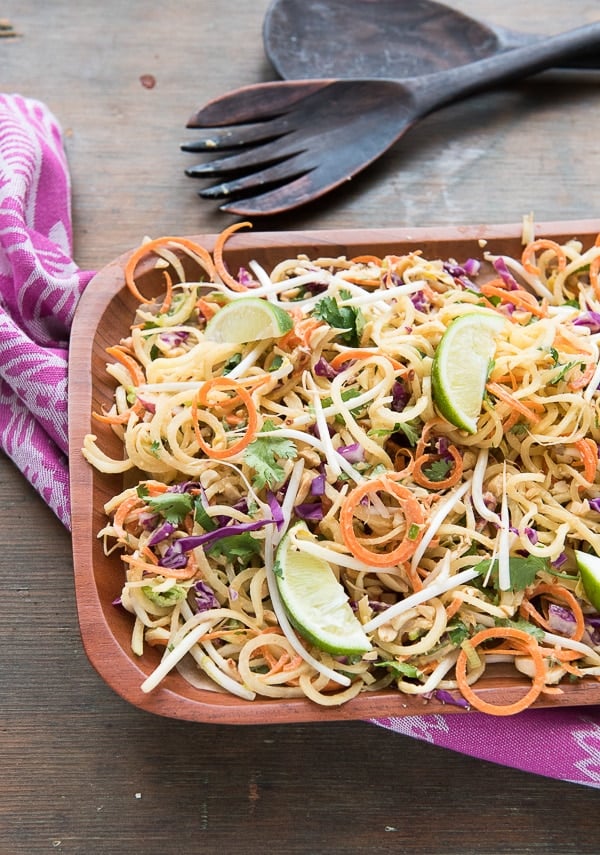 Pad Thai Salad with Spiralized Green Papaya and Spicy Peanut Dressing  in wood bowl