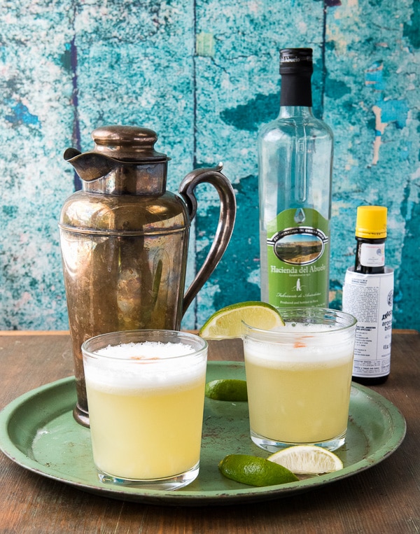 Peruvian Pisco Sour cocktail on green tray