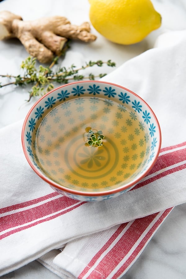 Steaming hot bowl of Slow Cooker Lemon and Ginger Vegetable Sipping Broth