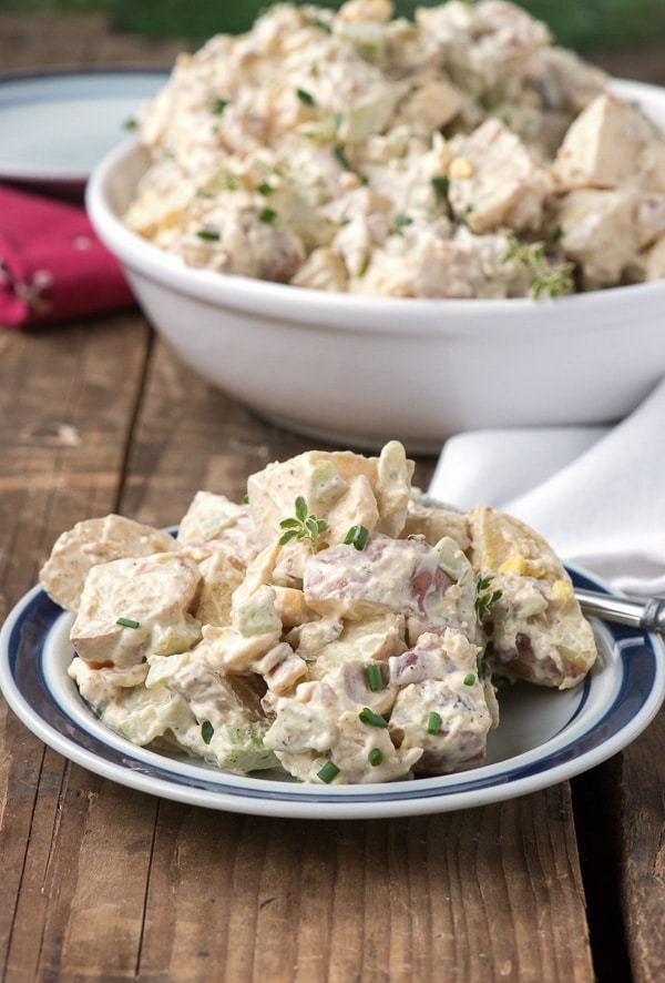 Grill-Smoked Creamy Smoked Potato Salad with Bacon side view on plate