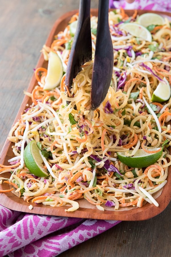 Pad Thai Salad with Spiralized Green Papaya and Spicy Peanut Dressing with tongs