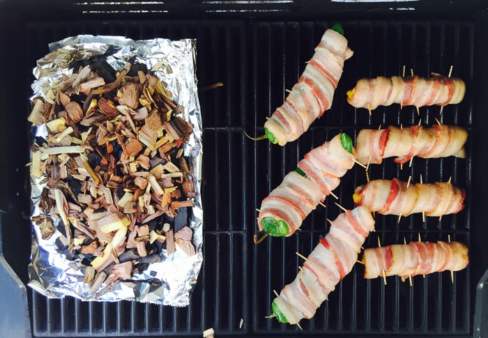 Bacon wrapped Hot Dogs and Peppers grill set up 