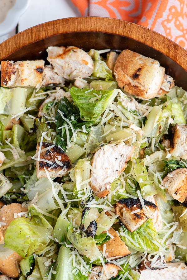 Close up of Grilled Chicken Caesar Salad with parmesan cheese