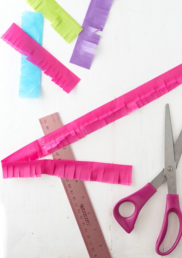 How to Make a Rainbow Milk Carton Pinata tutorial cutting tissue paper strips