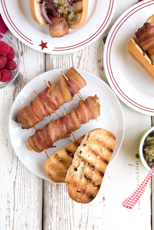 Mesquite-smoked Jalapeno Cheese Bacon-Wrapped Hot Dogs on plate