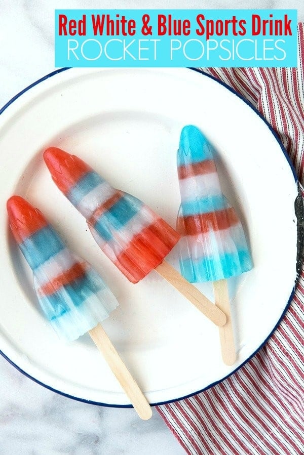 Red White and Blue striped Sports Drink Rocket Popsicles on a vintage enamel plate