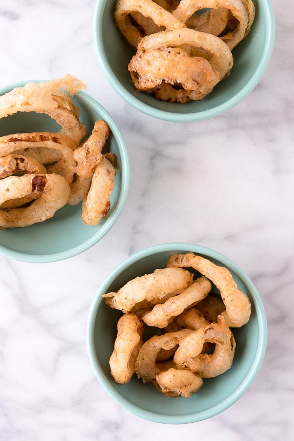 A plate of food on a table, with Onion ring