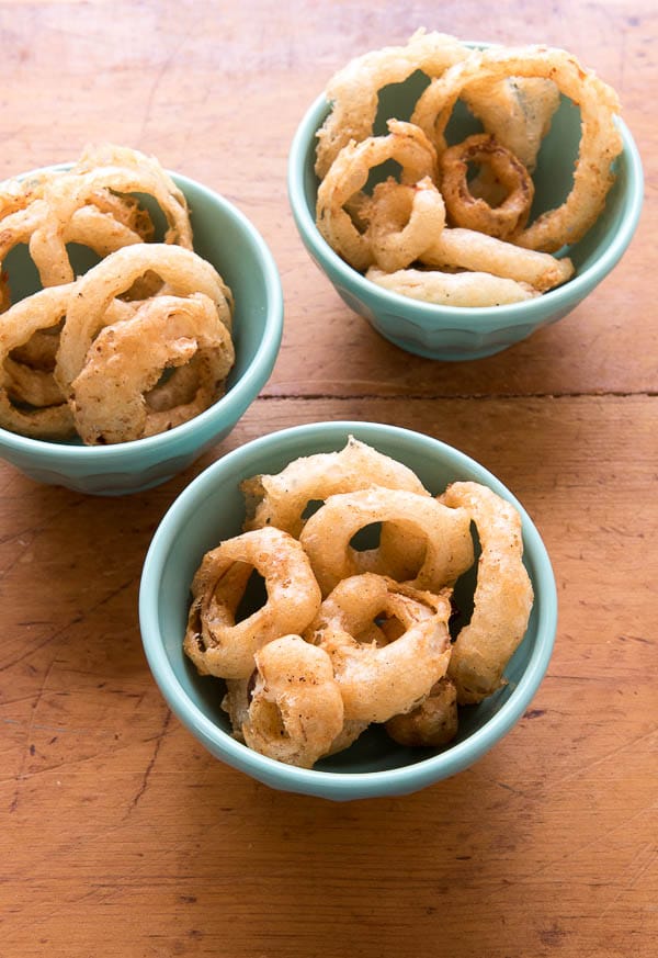 Spicy Beer-Battered Onion Rings in blue bowls