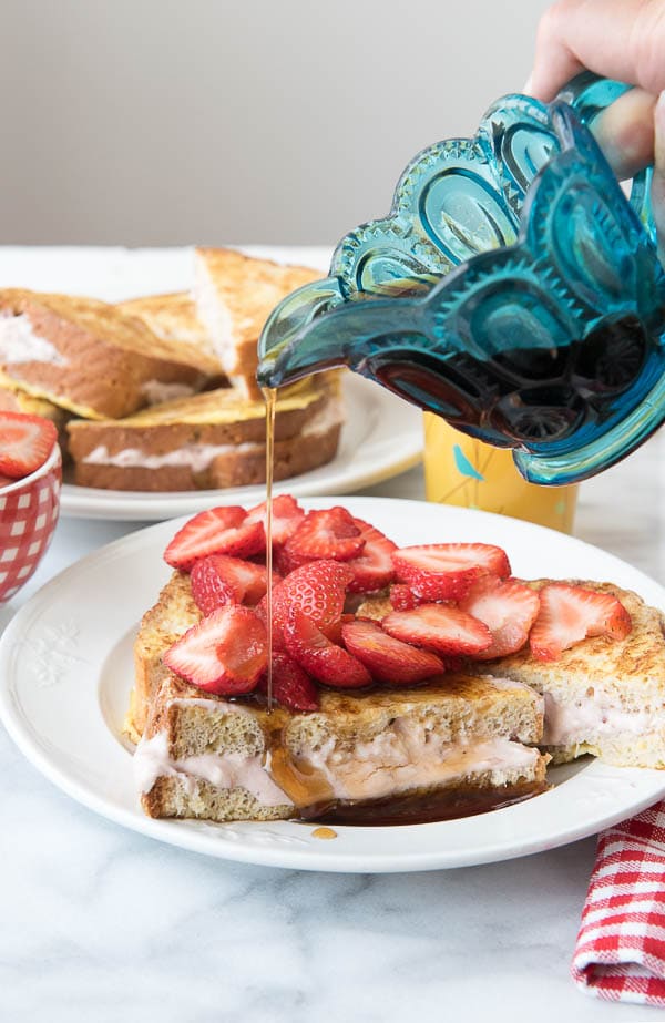 Strawberry Stuffed French Toast pouring syrup