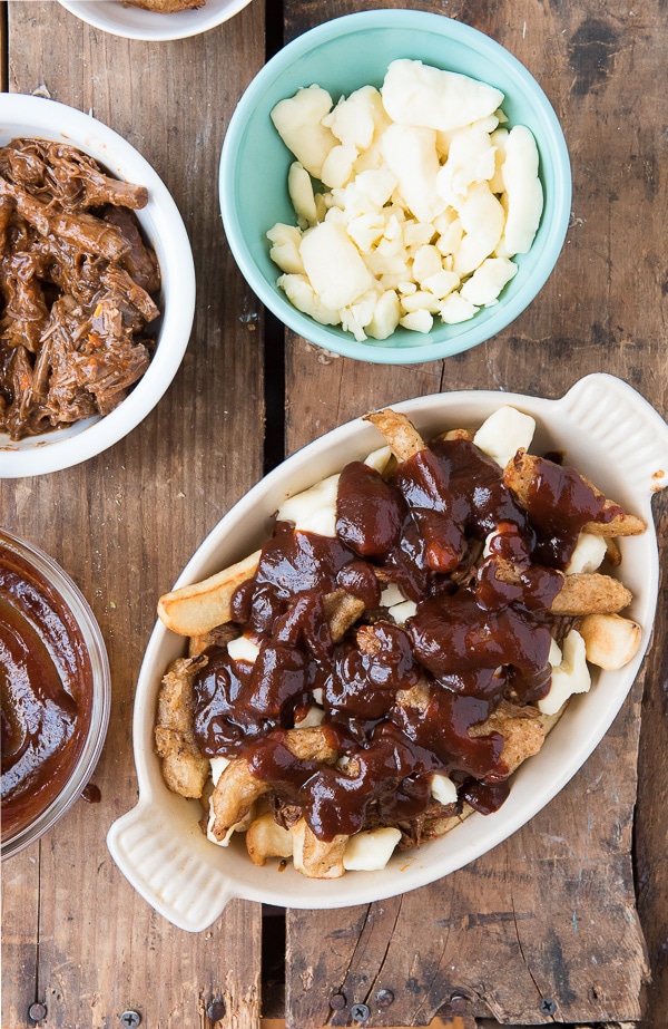 Barbecue Beef Poutine with Beer-Battered Onions in dish with ingredients