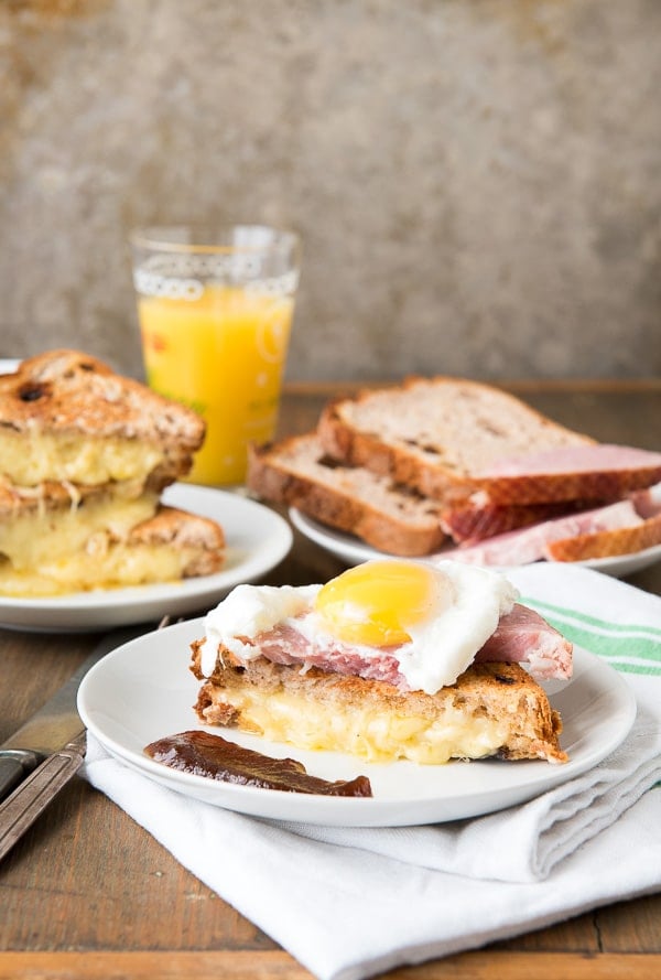 Breakfast Grilled Cheese Sandwich with Ham, Poached Egg, Apple Butter on plate