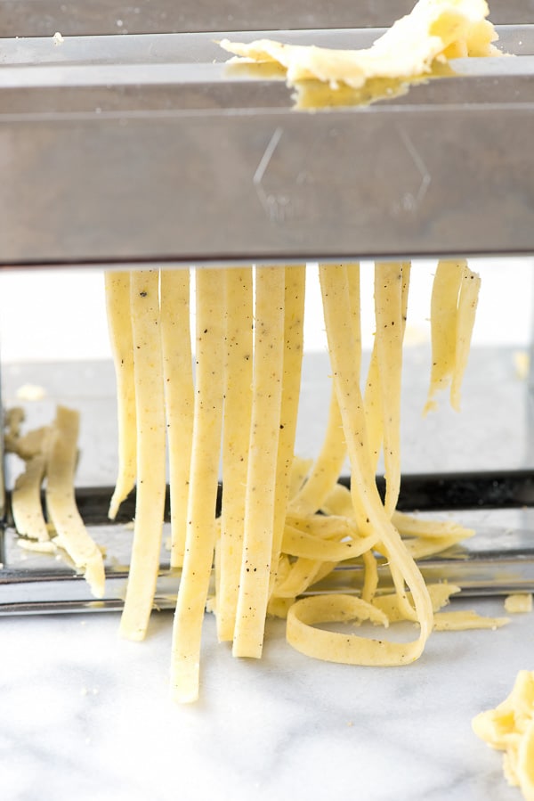 Homemade Gluten-Free Lemon Pepper Fettuccine Pasta - cutting pasta in pasta machine