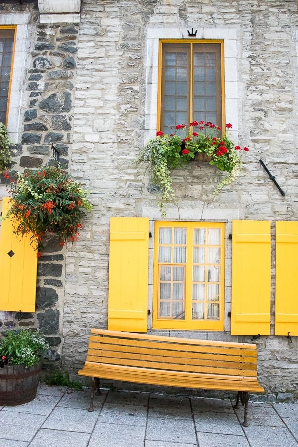 Quebec City, Lower City Stone Building with Yellow Shutters and Wooden Bench 