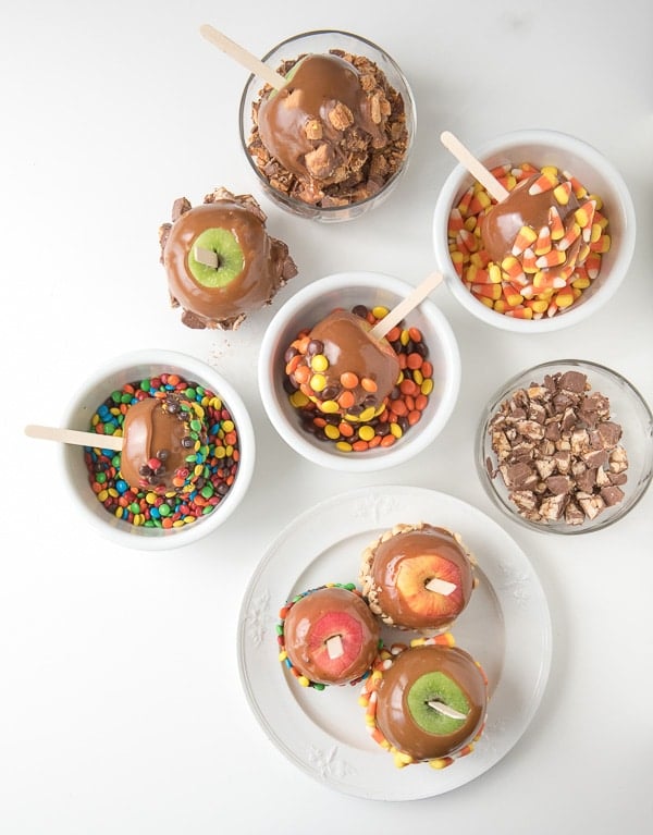 bowls of candy and caramel apples