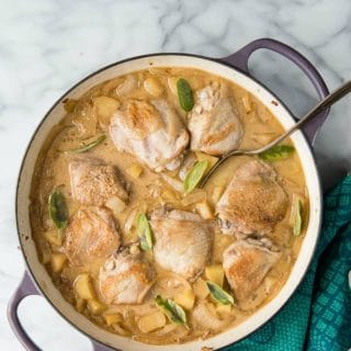 Cider Braised Chicken Thighs with Apples and Onions with fresh sage